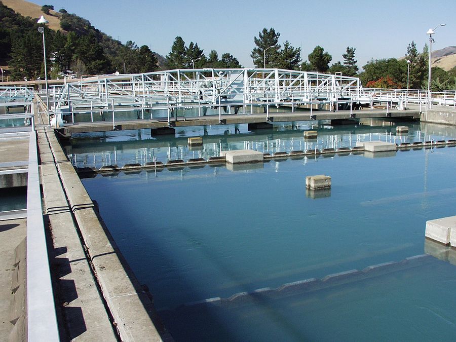 Overlooking water reservoir with trees and hills in background