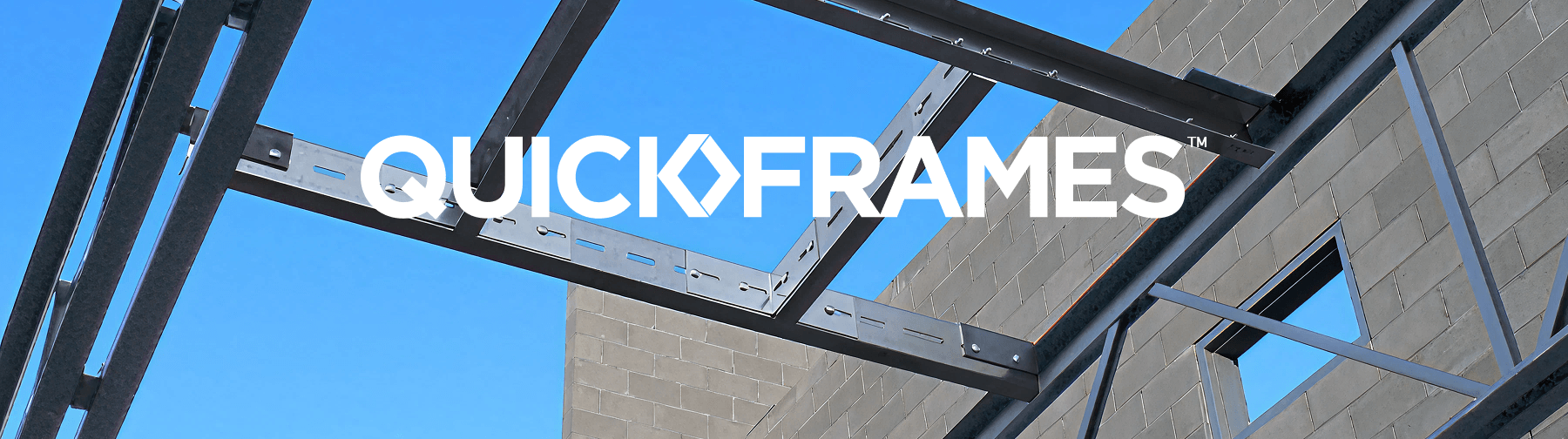 Steel framing system installed between masonry walls, showing interconnected metal beams against a blue sky, with overlaid text reading “QuickFrames”.